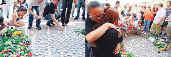 8月14日在奥贝维埃市市政府门口为张朝林举行悼念仪式的现场。（AFP/Getty Images）