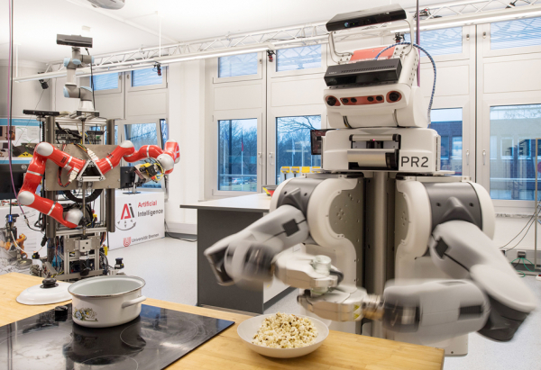 位于德国西北部的不来梅大学的人工智能研究所，研制的机器人在给爆米花撒盐。（AFP/Getty Images）