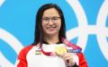 21岁的华裔泳将玛姬•麦克尼尔在本届东奥100米蝶泳决赛中，帮加拿大摘得首枚金牌。(Clive Rose/Getty Images)