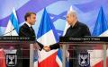 法国总统马克龙（左）与以色列总理内塔尼亚胡（右）10月24日在耶路撒冷的新闻发布会上。（CHRISTOPHE ENA/POOL/AFP via Getty Images）