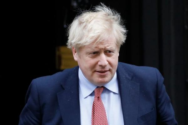 2020年3月18日，英国首相鲍里斯．约翰逊（Boris Johnson）离开伦敦市中心唐宁街10号，前往下议院出席首相问答。（图片来源：TOLGA AKMEN/AFP via Getty Images）